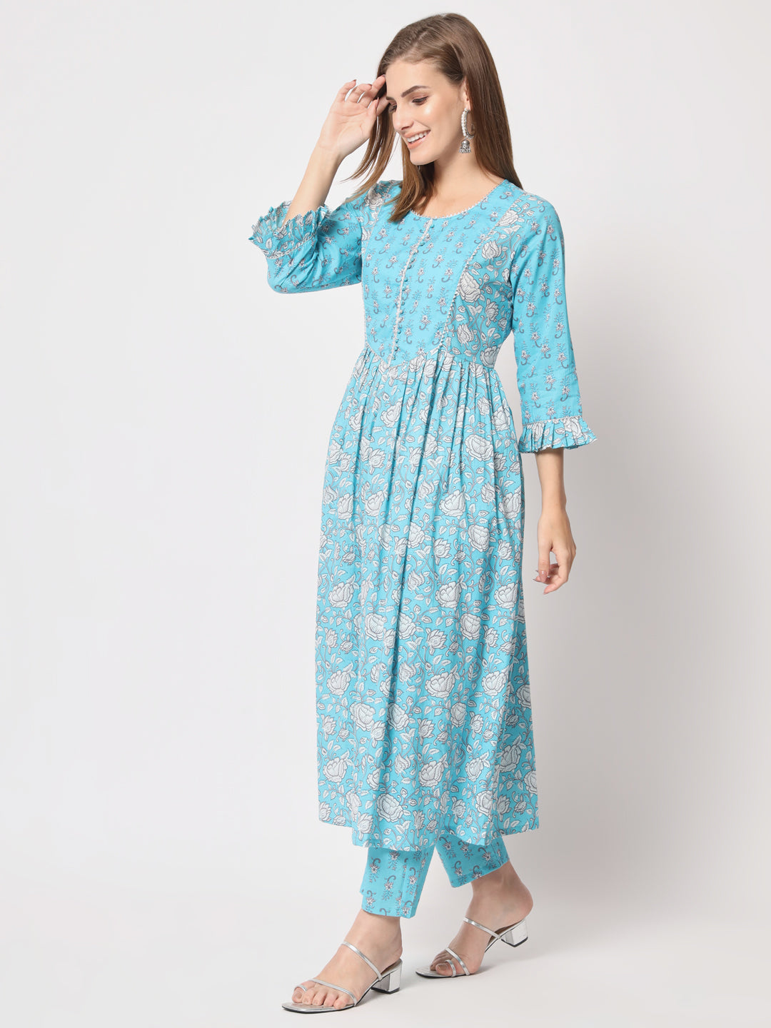 Turquoise printed pure cotton kurta set.