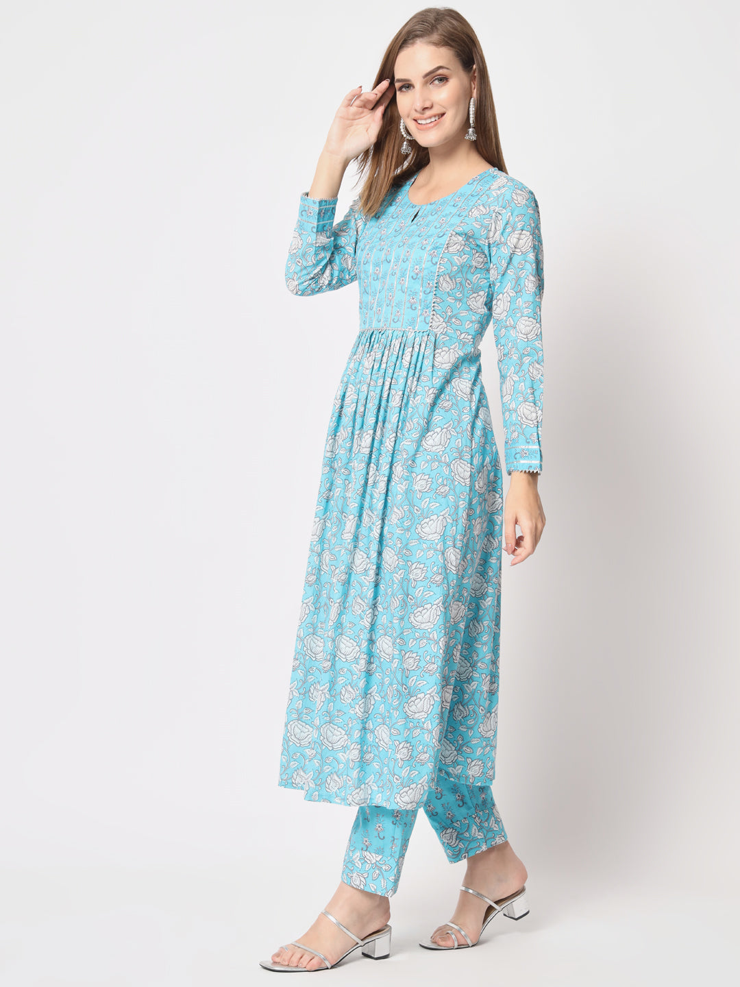 Turquoise printed pure cotton kurta set.