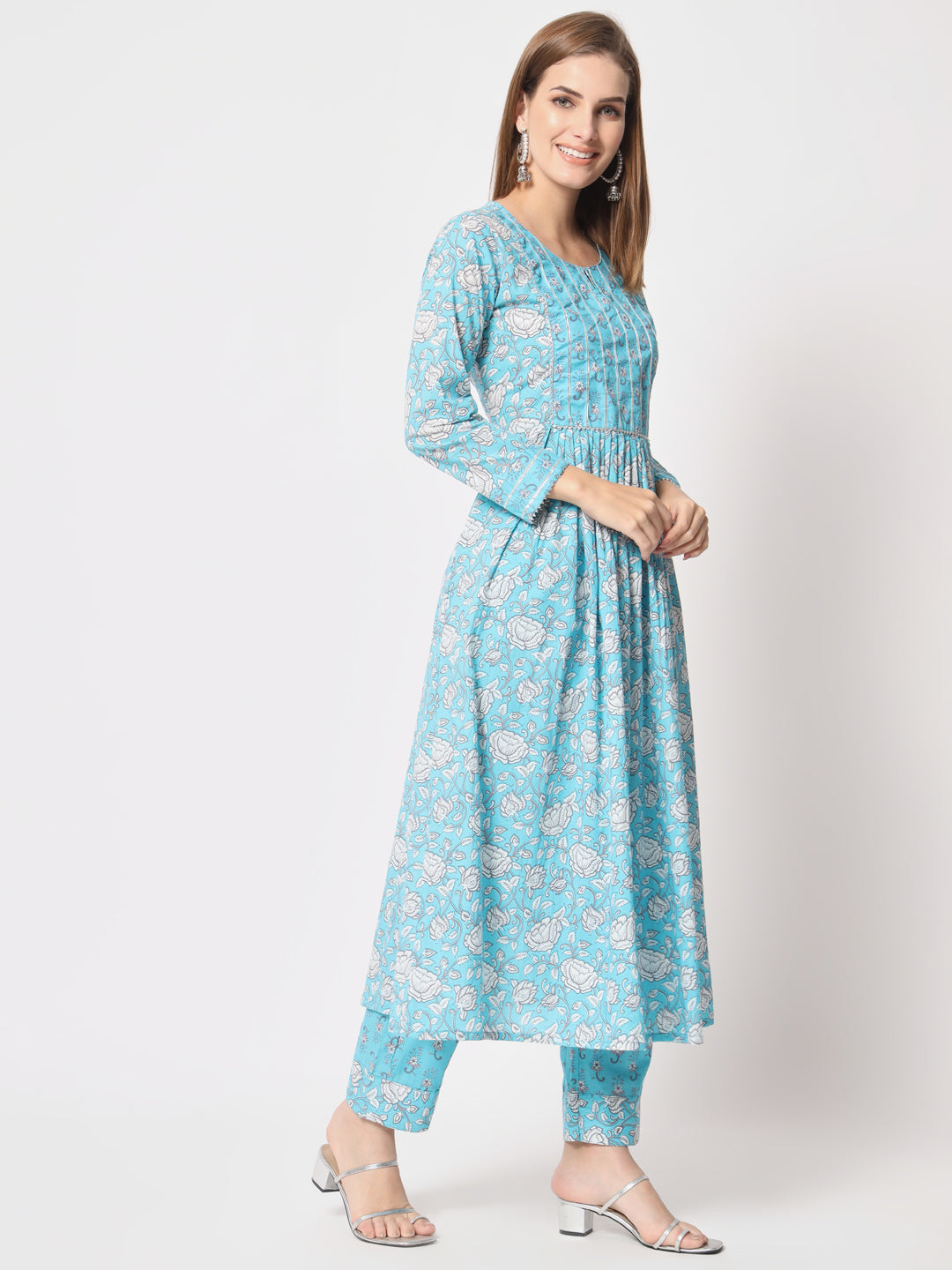 Turquoise printed pure cotton kurta set.