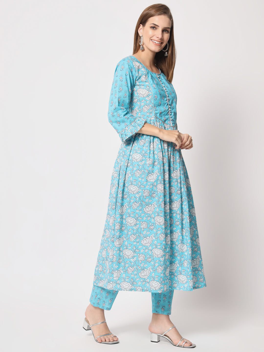 Turquoise printed pure cotton kurta set.