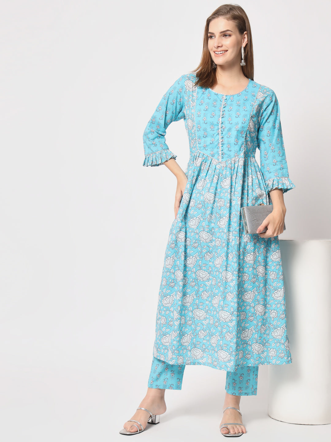 Turquoise printed pure cotton kurta set.