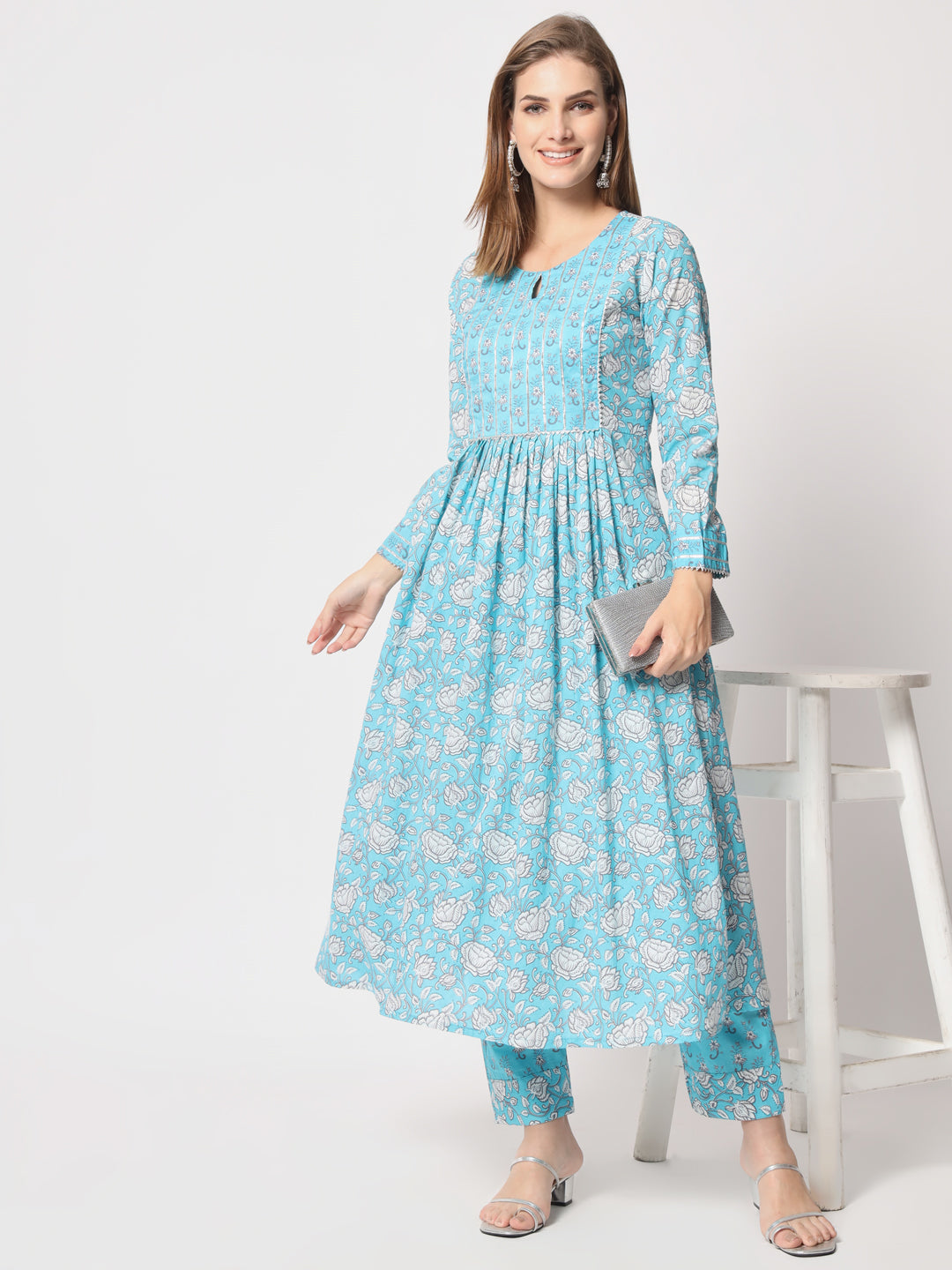 Turquoise printed pure cotton kurta set.