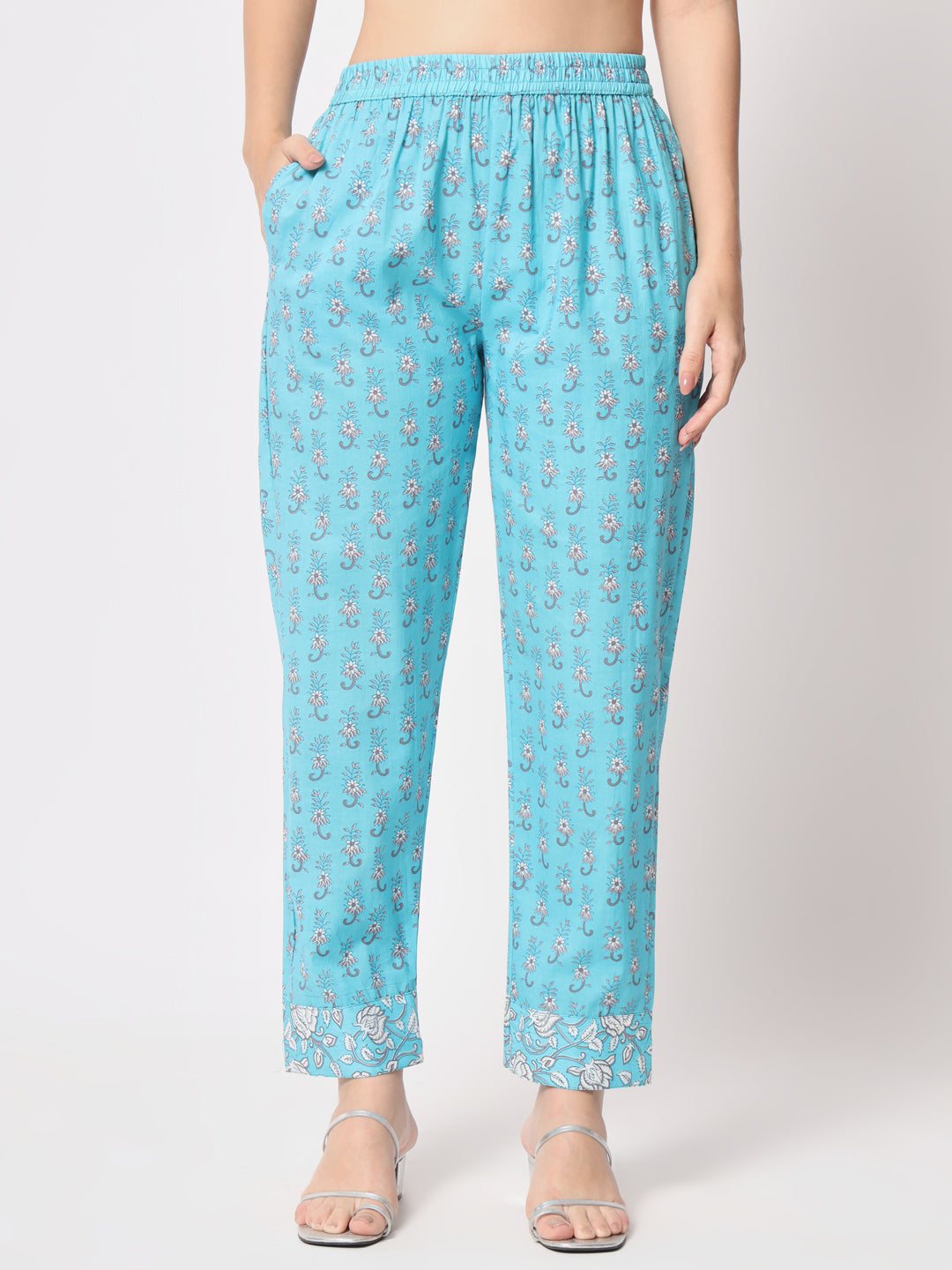 Turquoise printed pure cotton kurta set.