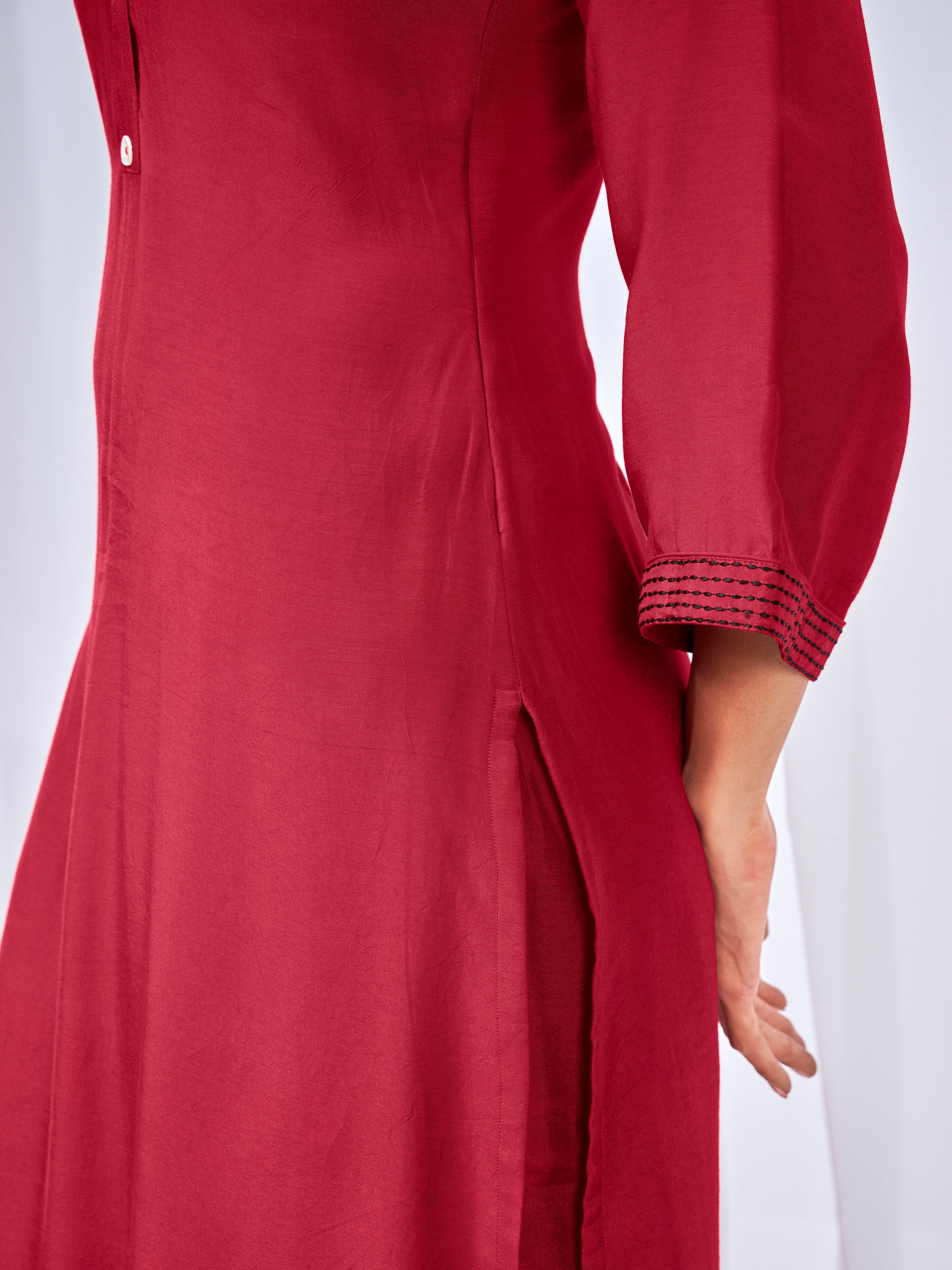 Red co-ord set with buttoned neckline